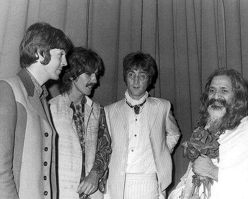 A photo of the Maharishi with Paul, George, and John, backstage at a Hilton Hotel in London after a lecture provided by the Maharishi. Original source: Transcendental Meditation, Switzerland Blog, blog.ch.tm.org/uncategorized/how-the-beatles-learned-transcendental-meditation-and-what-they-thought-about-it/.