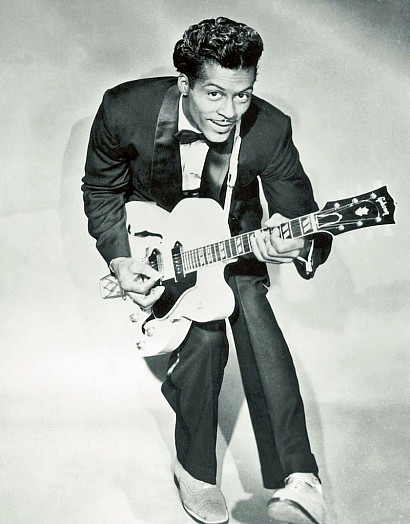 Chuck Berry does his "duck walk"