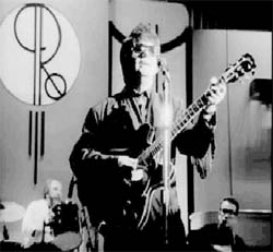 photo of Roy Orbison playing with the Traveling Wilburys